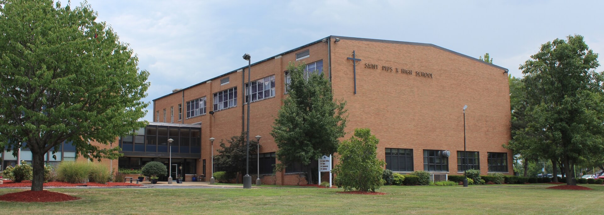 Exterior of St. Pius X High School - entrance and greenery