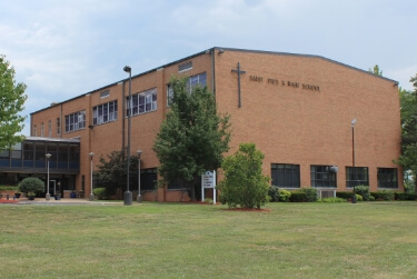 Exterior of St. Pius X High School - entrance and greenery